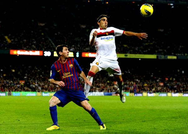 Leo Messi i Manuel Flores Chico; foto: Getty Images